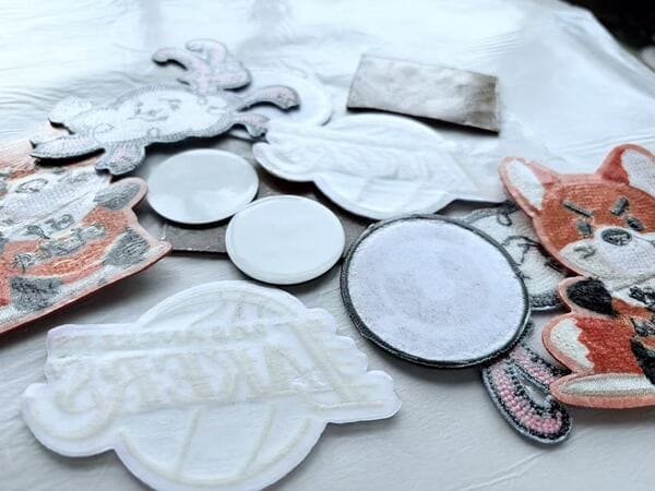 finished hot melt adhesive backing on custom patches